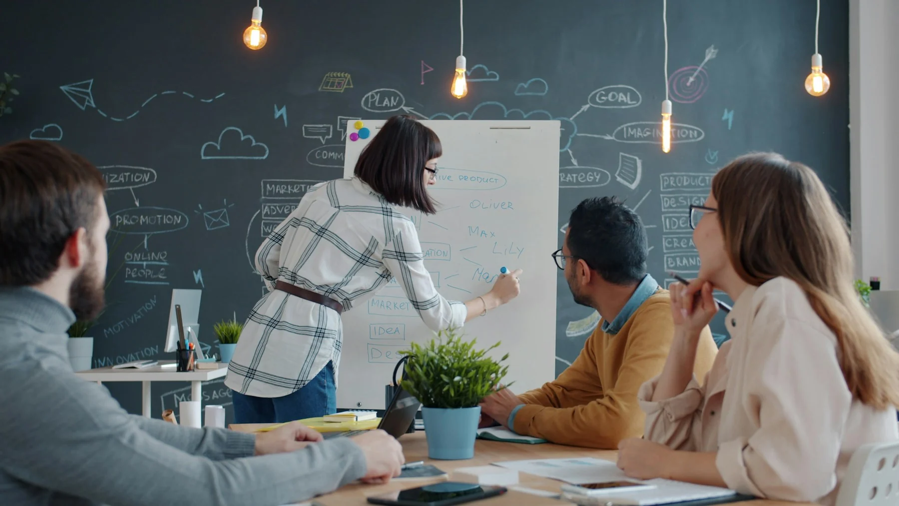 People collaborating around a table in a contemporary office